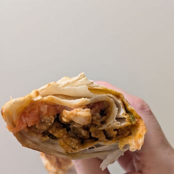 Tahini's Shawarma - Cross-section of my butter chicken wrap - Middle Eastern Near Me - Richmond Hill, Ontario Tahini's Shawarma - Cross-section of my butter chicken wrap - Middle Eastern Near Me - Richmond Hill, Ontario