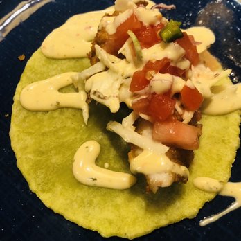 Yollah Social Kitchen & Garden - Fish taco - not sure why tortilla is green?! Maybe a lettuce wrap - Latin American Near Me - Macon, Georgia Yollah Social Kitchen & Garden - Fish taco - not sure why tortilla is green?! Maybe a lettuce wrap - Latin American Near Me - Macon, Georgia