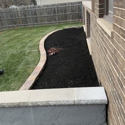 Brick retaining wall to separate mulch from yard after cleaning up all the plants that didn't make it from the previous year. Brick retaining wall to separate mulch from yard after cleaning up all the plants that didn't make it from the previous year.