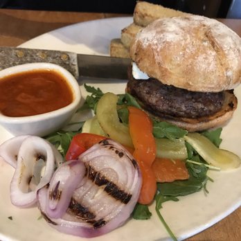 Lola - Hiding behind this amazing lamb burger is the best part of this meal: chick pea fries!!! - Greek Near Me - Seattle, Washington Lola - Hiding behind this amazing lamb burger is the best part of this meal: chick pea fries!!! - Greek Near Me - Seattle, Washington