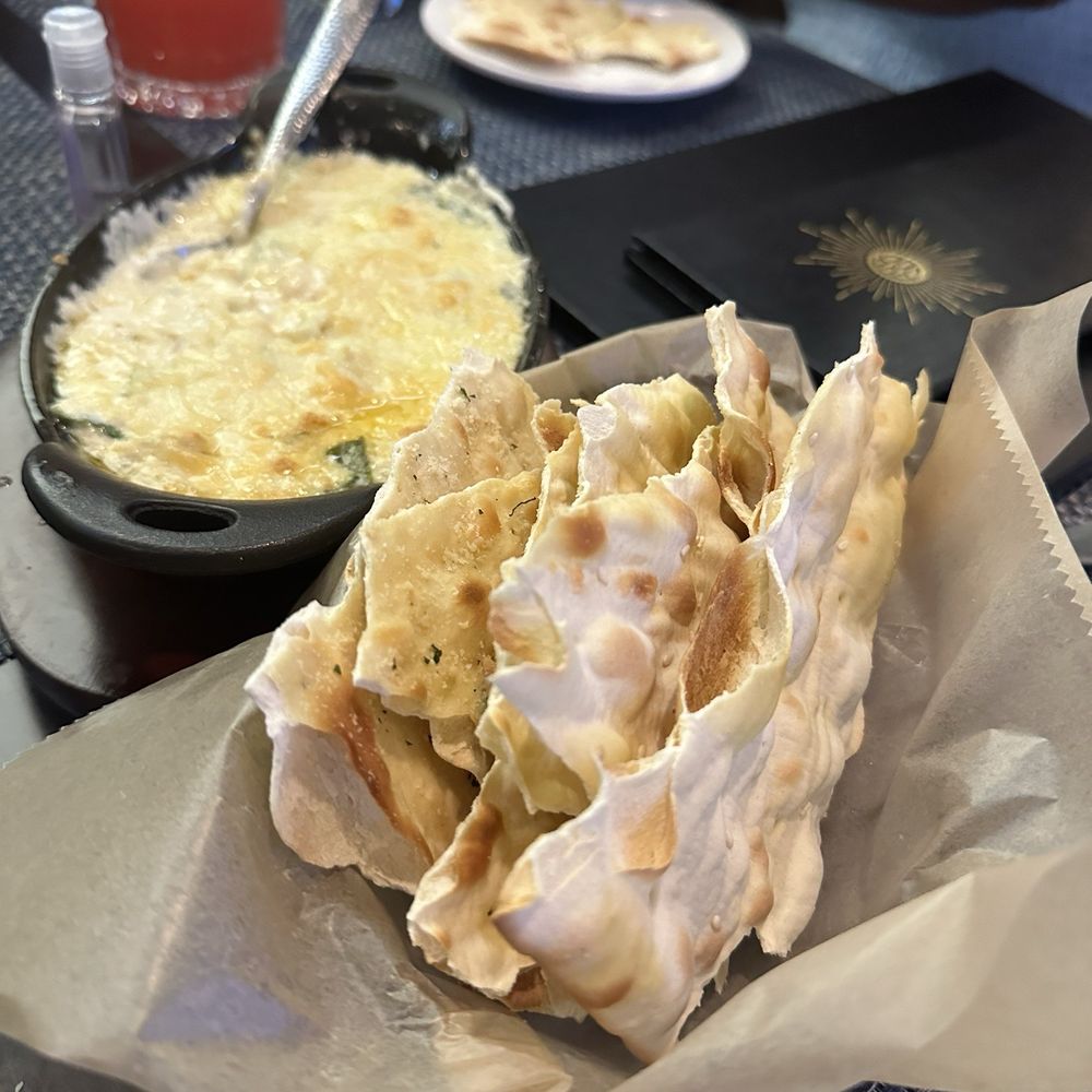 Bottles & Bones - Spinach artichoke dip - Bars Near Me - Suwanee, Georgia