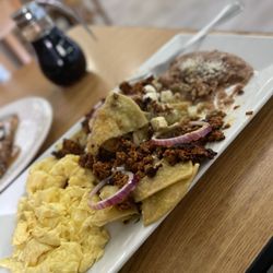 Daddy's Kitchen - Chilaquiles with salsa verde, scrambled eggs and chorizo.