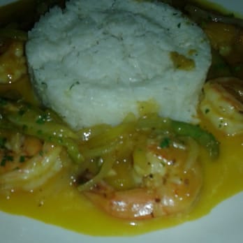 Salsa Con Fuego - Jumbo shrimp seared in a mango sauce served over white rice with peppers and onions - Bars Near Me - Bronx, New York Salsa Con Fuego - Jumbo shrimp seared in a mango sauce served over white rice with peppers and onions - Bars Near Me - Bronx, New York