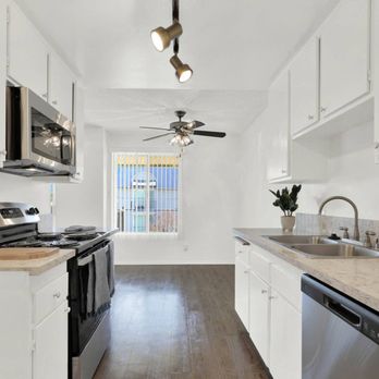 Casa De Oro Apartments - a kitchen with white cabinets and stainless steel appliances - Apartments Near Me - Torrance, California Casa De Oro Apartments - a kitchen with white cabinets and stainless steel appliances - Apartments Near Me - Torrance, California