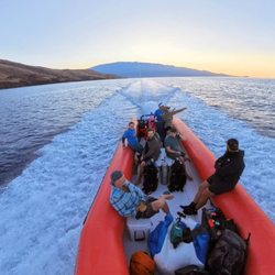 Maui Pacific Divers - The sun begins to rise over Haleakala as we head out to find whales and stunning dive sites