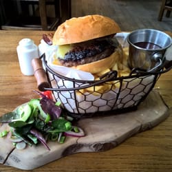 Plough Inn - Excellent burger with French fries. The real challenge is to eat the salad off the board without making a mess.
