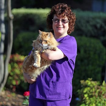 Windsor Park Veterinary Clinic - Dr. Geigel and Orange pose in front of our new roses! - Veterinarians Near Me - Austin, Texas Windsor Park Veterinary Clinic - Dr. Geigel and Orange pose in front of our new roses! - Veterinarians Near Me - Austin, Texas