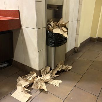 AMC Rainbow Promenade 10 - Trash all over floor and overfilled trash can - Cinema Near Me - Las Vegas, Nevada