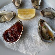 Photo of Kingsleys Steak & Crabhouse - Woolloomooloo New South Wales, Australia. 4 naked, 1 Kilpatrick (front left), 1 chili-coriander (front right)