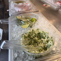 Lilly's Tacos - Salsa bar well stocked with 3 types of salsas, lime, radish and cilantro