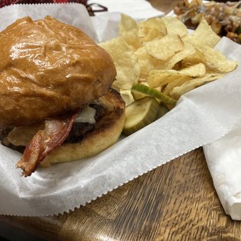 The Daily Grind - a burger and chips on a table - Coffee & Tea Near Me - Quarryville, Pennsylvania The Daily Grind - a burger and chips on a table - Coffee & Tea Near Me - Quarryville, Pennsylvania