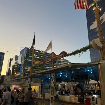 Cisco Seaport - a crowd of people at a food stand - Beer Gardens Near Me - Boston, Massachusetts