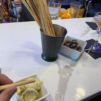 Rolling Still Distillery and Lounge - Breadsticks with rosemary-sage butter and marinated olives - Distilleries Near Me - Taos, New Mexico
