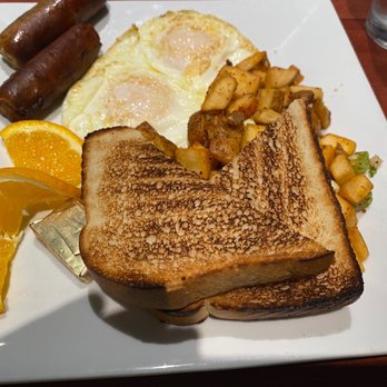 Bistro St Michael - Traditional breakfast with two eggs over easy, two sausages, sourdough toast, and potatoes - Coffee & Tea Near Me - Prescott, Arizona