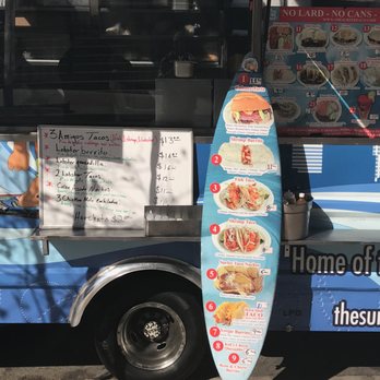 Bistro Planet - a surfboard leaning up against a food truck - Food Trucks Near Me