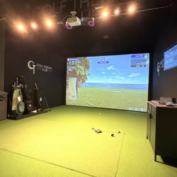 Golf Therapy Club - One of the bays Very nice and roomy Has a bag holder and comfy couches