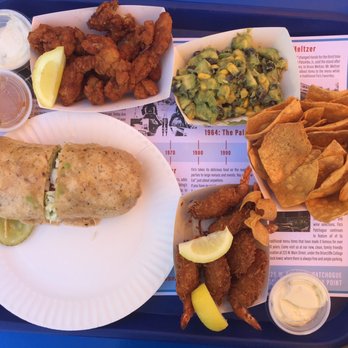 Flo's Luncheonette - Our order of tastiness. Clam strips, summer salsa, coconut shrimp, and The Big EZ wrap. - American Near Me - Blue Point, New York Flo's Luncheonette - Our order of tastiness. Clam strips, summer salsa, coconut shrimp, and The Big EZ wrap. - American Near Me - Blue Point, New York