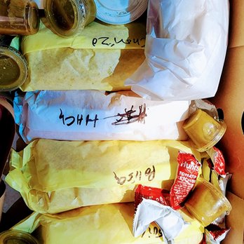 Athenian III - Breakfast burritos in the box ready to be tore up. - Burgers Near Me - Buena Park, California Athenian III - Breakfast burritos in the box ready to be tore up. - Burgers Near Me - Buena Park, California