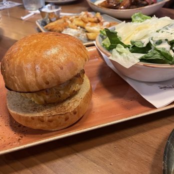 The Cage - Crabcake sandwich with a Caesar salad - Cocktail Bars Near Me - Warrington, Pennsylvania The Cage - Crabcake sandwich with a Caesar salad - Cocktail Bars Near Me - Warrington, Pennsylvania