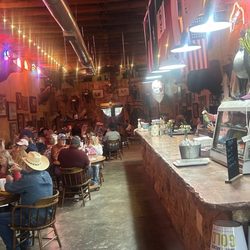 Blue Agave Cattle Company - Bar view looking towards entry. Check out the wagon suspended from the ceiling.
