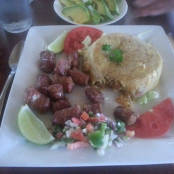 Millys Restaurant - Mogongo with sausage minus one bite - Latin American Near Me - Miami, Florida Millys Restaurant - Mogongo with sausage minus one bite - Latin American Near Me - Miami, Florida