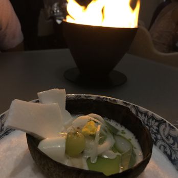 Alinea - This dish takes you to the tropics - coconut, a hint of saltiness and flames dancing in the background - New American Near Me - Chicago, Illinois Alinea - This dish takes you to the tropics - coconut, a hint of saltiness and flames dancing in the background - New American Near Me - Chicago, Illinois