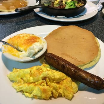 Thumbs Up Diner - Cheesy grits, pancake, eggs scrambled hard w/cheese & sausage. - American Near Me - East Point, Georgia Thumbs Up Diner - Cheesy grits, pancake, eggs scrambled hard w/cheese & sausage. - American Near Me - East Point, Georgia