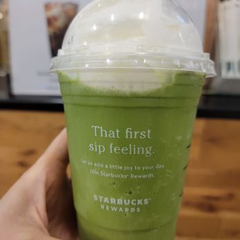 Starbucks - a hand holding a cup of green tea - Coffee & Tea Near Me - Houston, Texas