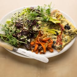Green Door Catering - This is the Greek quiche plate with feta, spinach, basil, olives & sun dried tomato accompanied with savory baked yams & salad