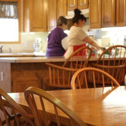 Pioneer Cottages Memory Care - "It feels like home." Pioneer Cottages residents are invited to share in household activities.