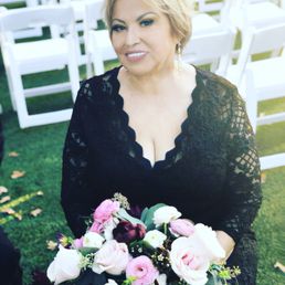 My mom holding my sisters bouquet! Gorgeous arrangement :)