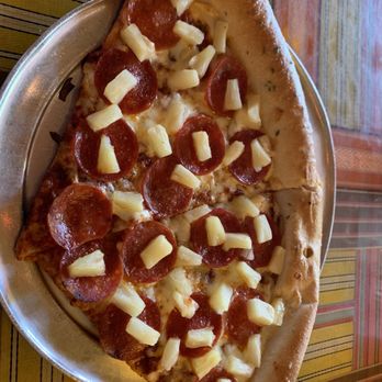 Satchel's Pizza - 2 slices of pizza with pepperoni and pineapple - Pizza Near Me - Gainesville, Florida