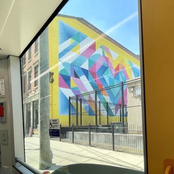 Cincinnati Bell Connector - A mural on Race St, north of Findlay Market, viewed from the Connector streetcar - Trains Near Me - Cincinnati, Ohio