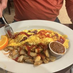 The Grumpy Veteran - Breakfast special - ham and Swiss omelette , served with toast, beans & homefries