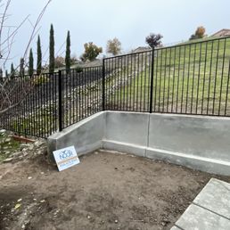 They installed a beautiful new steel re enforced concrete retaining wall to replace a failed wood retaining wall. They installed a beautiful new steel re enforced concrete retaining wall to replace a failed wood retaining wall.