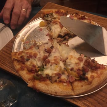 Moonraker Pub - a slice of pizza on a plate - Sports Bars Near Me - Cromwell, Indiana Moonraker Pub - a slice of pizza on a plate - Sports Bars Near Me - Cromwell, Indiana
