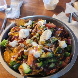 Black River Tavern - Pulled Pork Nachos with a side of sour cream.