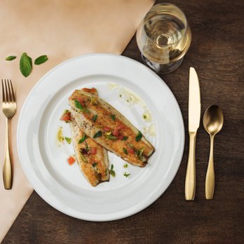 Stella Van Buren - Mediterranean Branzino - grapefruit, olive and pistachio relish - Italian Near Me - Milwaukee, Wisconsin Stella Van Buren - Mediterranean Branzino - grapefruit, olive and pistachio relish - Italian Near Me - Milwaukee, Wisconsin