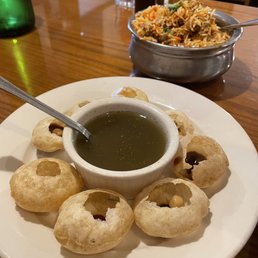 a bowl of soup and a plate of appetizers a bowl of soup and a plate of appetizers