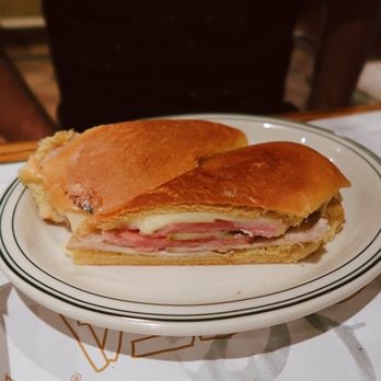 La Carreta - Media Noche Sandwich: Sweet Egg Roll with Ham, Roast Pork, Swiss Cheese, Mustard and Pickles - Cuban Near Me - Miami, Florida