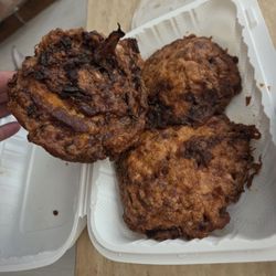 Egg foo young 3 pancakes of egg foo young and half container of brown sauce instead of traditional gravy that goes with egg foo young.