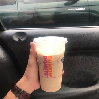 Dunkin' -  a hand holding a cup of coffee - Coffee & Tea Near Me - Maryville, Tennessee