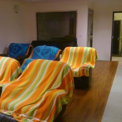 Seoul Health Spa - Corridor facing Jade Stone room in back left, recliners on left. open door is laundry room