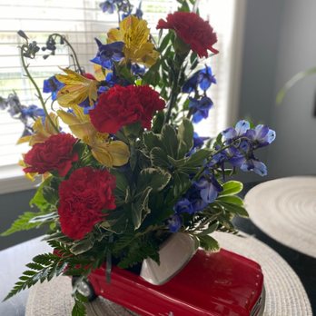 Designs By Diedrich - alstroemeria, carnations, chrysanthemums, delphinium, sinuata statice, leatherleaf & sword fern in a '65 Ford Mustang - Florists Near Me - Joliet, Illinois