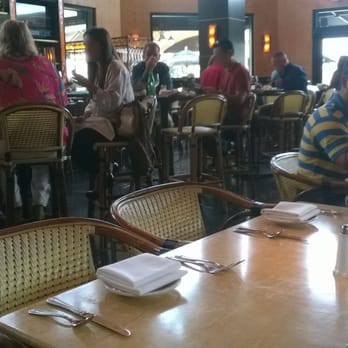 The Cheesecake Factory - Interior view showing unhygienic placement of cutlery right on the table top. Be sure to ask for a new set! - American Near Me - San Juan, Puerto Rico