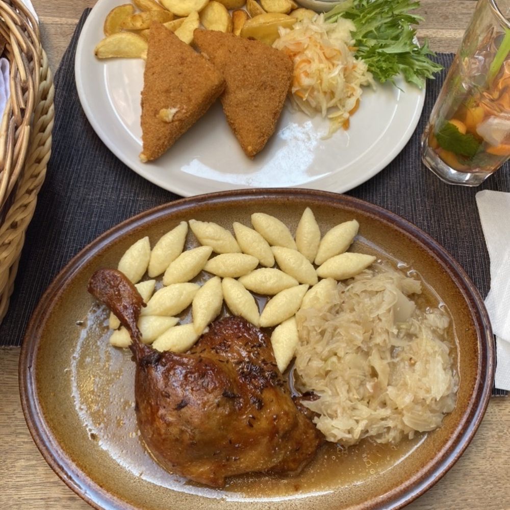 Mlejnice - Fried Cheese with American potatoes, tartar sauce, and sour cabbage. Duck thigh with potato gnocchi, and cabbage. - Czech Near Me - Prague, Puerto Rico Mlejnice - Fried Cheese with American potatoes, tartar sauce, and sour cabbage. Duck thigh with potato gnocchi, and cabbage. - Czech Near Me - Prague, Puerto Rico
