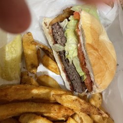 Clubhouse Bar and Grill - Bacon and Blue Burger (ordered well done), half was removed to show a side cut.