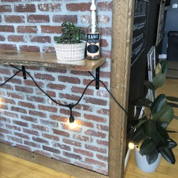 The Cracked Mug - a brick wall and a shelf with a plant - Breakfast & Brunch Near Me - Block Island, Rhode Island The Cracked Mug - a brick wall and a shelf with a plant - Breakfast & Brunch Near Me - Block Island, Rhode Island