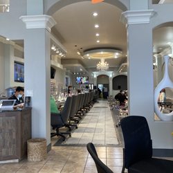 Holiday Manor Nails - Long line of nail stations and pedi chairs
