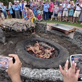 Old Lahaina Luau - Finished pig being removed from the cooking area - Performing Arts Near Me - Lahaina, Hawaii